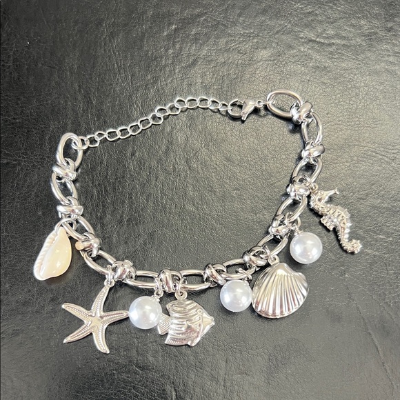 Amazon Jewelry - Amazon Silver Charm Bracelet with White Pearl and Shell Accents